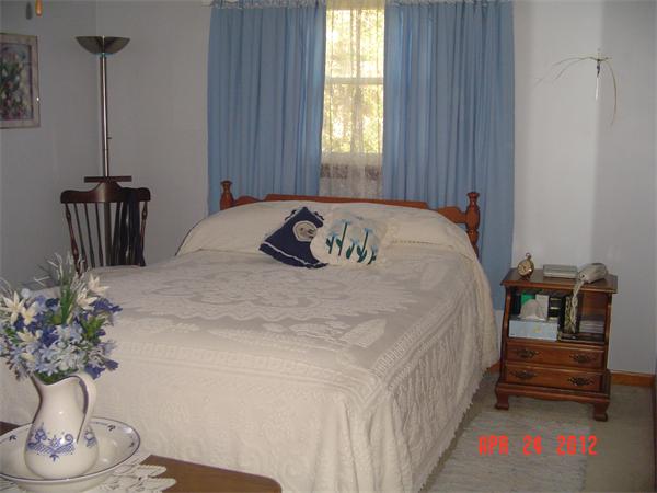 30 Morton Road Freetown, MA 02717 - Photo 5 of 12 a bedroom with a bed and a potted plant