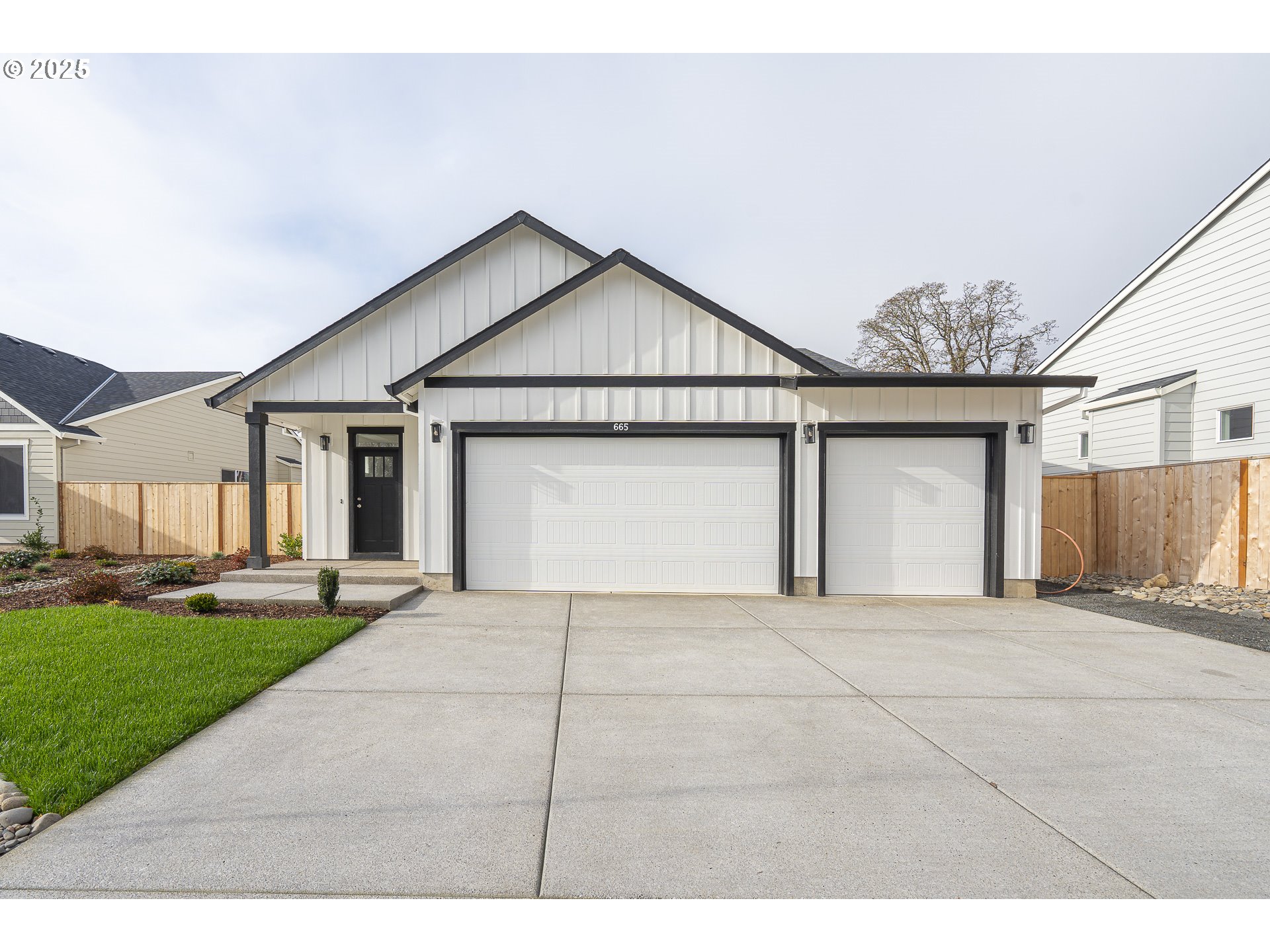 665 Parker Loop Silverton, OR 97381 - Photo 2 of 38 a view of garage and yard