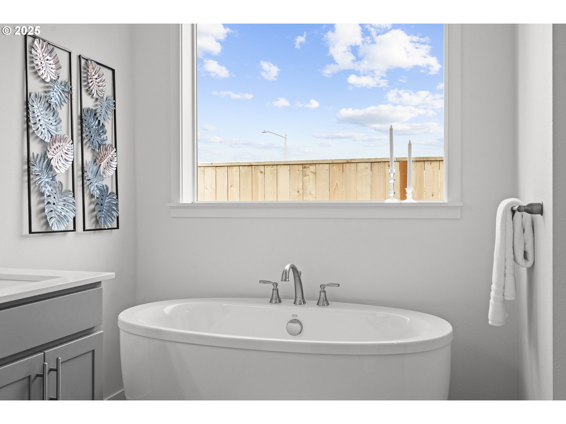 665 Parker Loop Silverton, OR 97381 - Photo 32 of 38 a bathroom with a sink mirror and a window