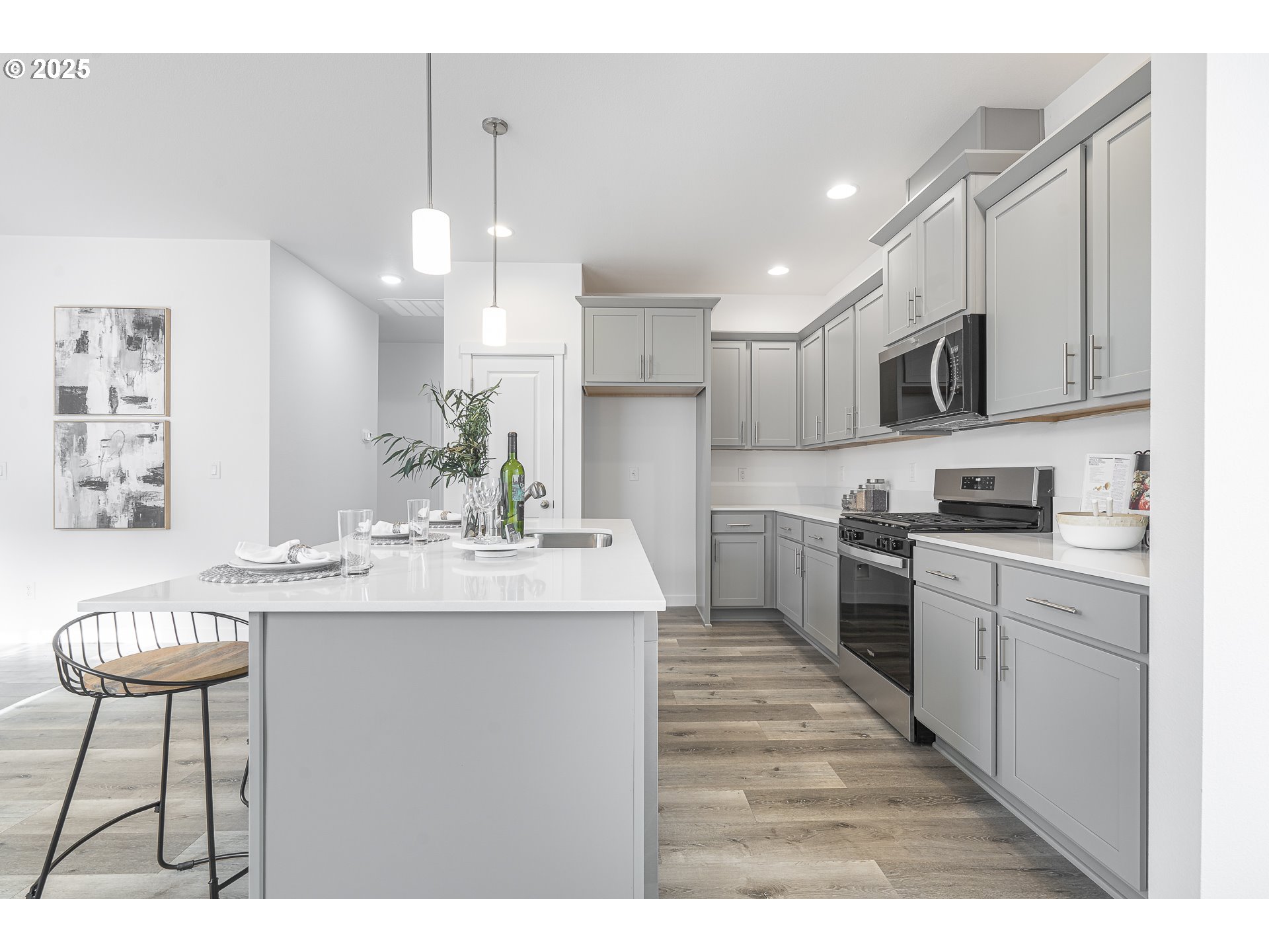 665 Parker Loop Silverton, OR 97381 - Photo 8 of 38 a kitchen with kitchen island granite countertop a sink and cabinets