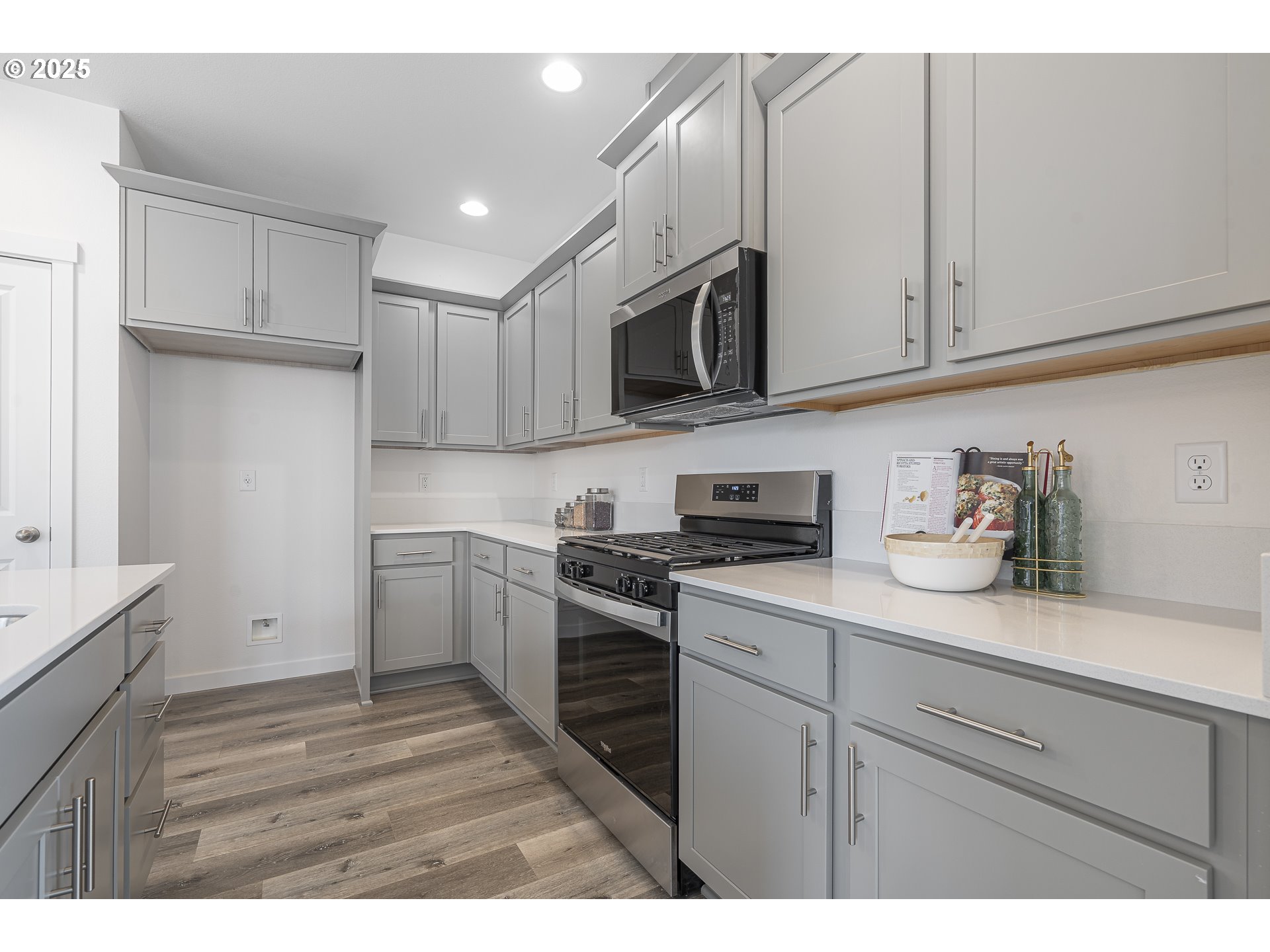 665 Parker Loop Silverton, OR 97381 - Photo 9 of 38 a kitchen with cabinets stainless steel appliances and sink