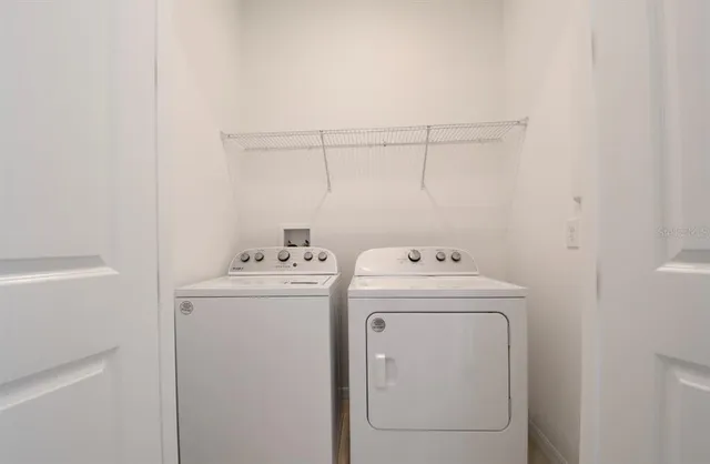 a utility room with dryer and washer