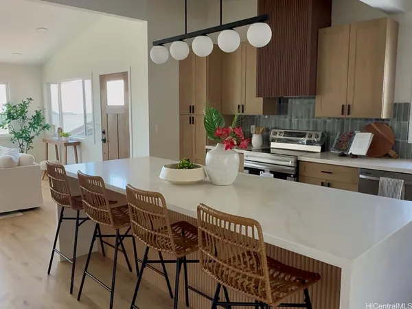 a kitchen with a table chairs stove and cabinets