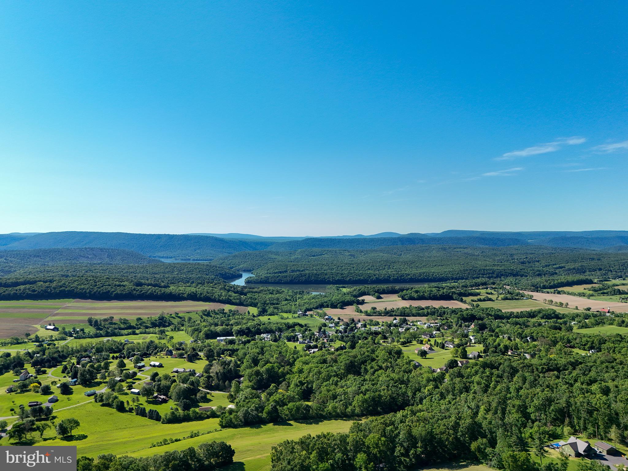 Mountain Road James Creek, PA 16657 - Photo 2 of 28 Serene countryside under clear skies.