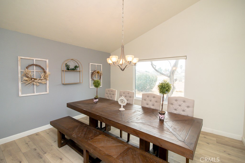 20376 Tonawanda Road Apple Valley, CA 92307 - Photo 14 of 67 a view of a dining room with furniture and wooden floor