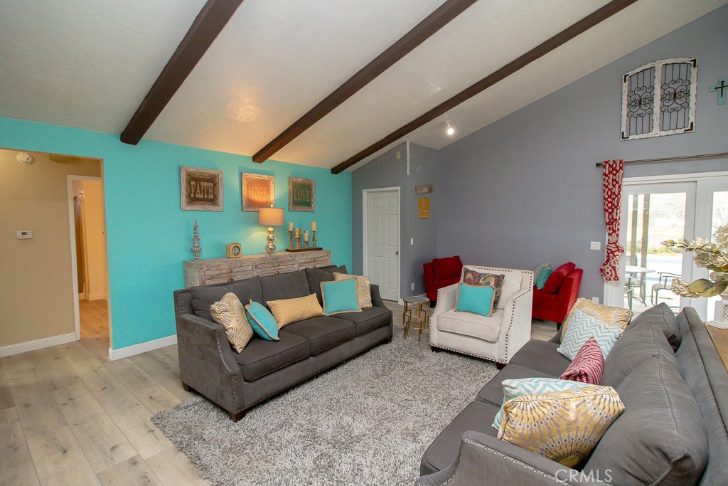 20376 Tonawanda Road Apple Valley, CA 92307 - Photo 15 of 67 a living room with furniture and a couch