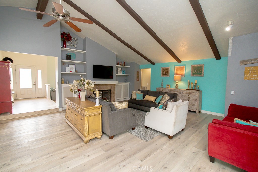 20376 Tonawanda Road Apple Valley, CA 92307 - Photo 16 of 67 a living room with furniture and a flat screen tv