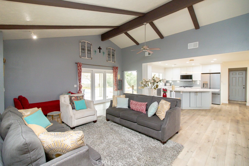 20376 Tonawanda Road Apple Valley, CA 92307 - Photo 18 of 67 a living room with furniture and a large window