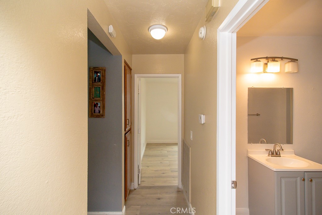 20376 Tonawanda Road Apple Valley, CA 92307 - Photo 33 of 67 a bathroom with a sink mirror and shower