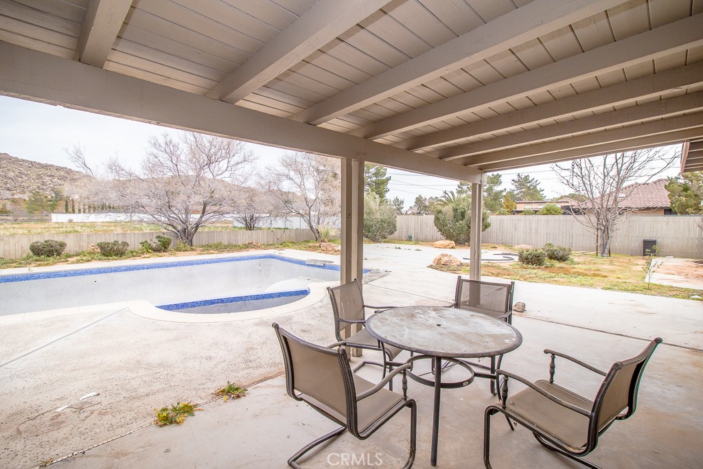 20376 Tonawanda Road Apple Valley, CA 92307 - Photo 43 of 67 a view of a dining room with furniture window and outside view