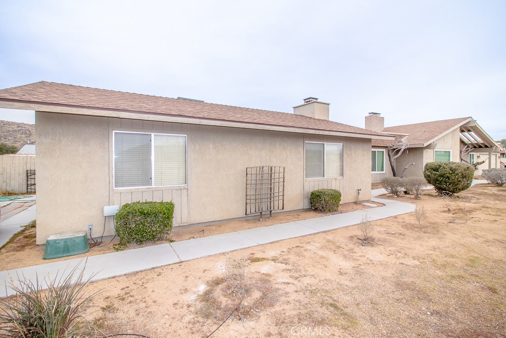 20376 Tonawanda Road Apple Valley, CA 92307 - Photo 49 of 67 a view of a house with a patio