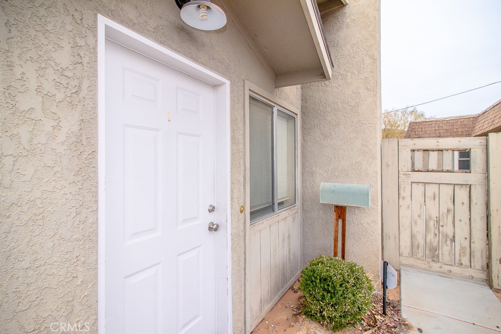 20376 Tonawanda Road Apple Valley, CA 92307 - Photo 50 of 67 a front view of a house with a yard