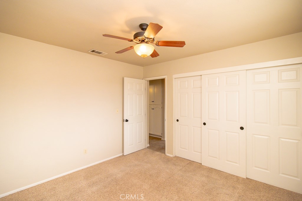 20376 Tonawanda Road Apple Valley, CA 92307 - Photo 59 of 67 a view of a chandelier fan in a room