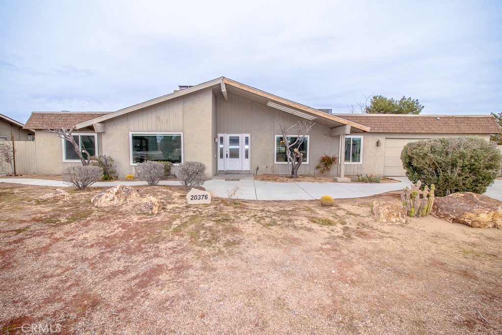 20376 Tonawanda Road Apple Valley, CA 92307 - Photo 6 of 67 a house view with a outdoor space