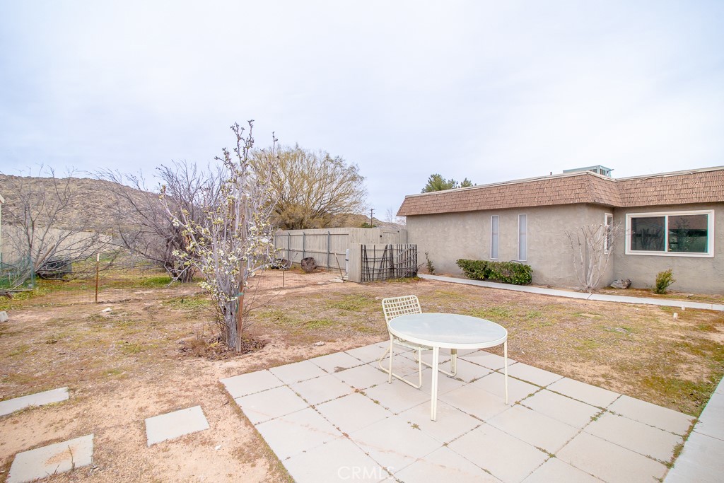 20376 Tonawanda Road Apple Valley, CA 92307 - Photo 65 of 67 a view of a swimming pool with a lounge chairs