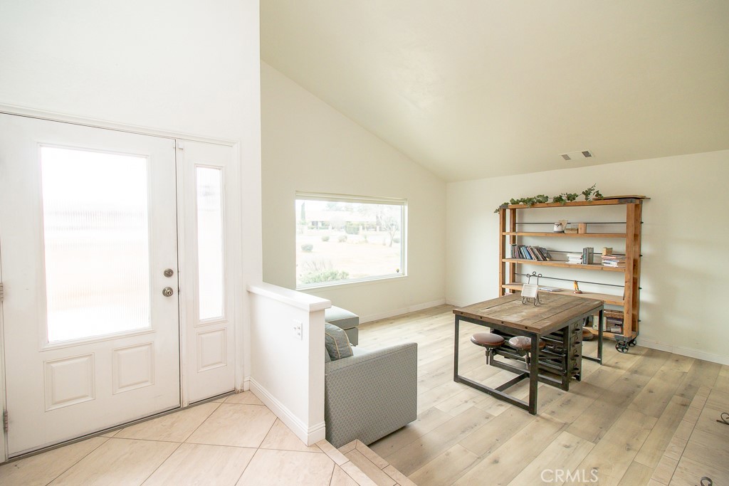 20376 Tonawanda Road Apple Valley, CA 92307 - Photo 8 of 67 a workspace with furniture and a window