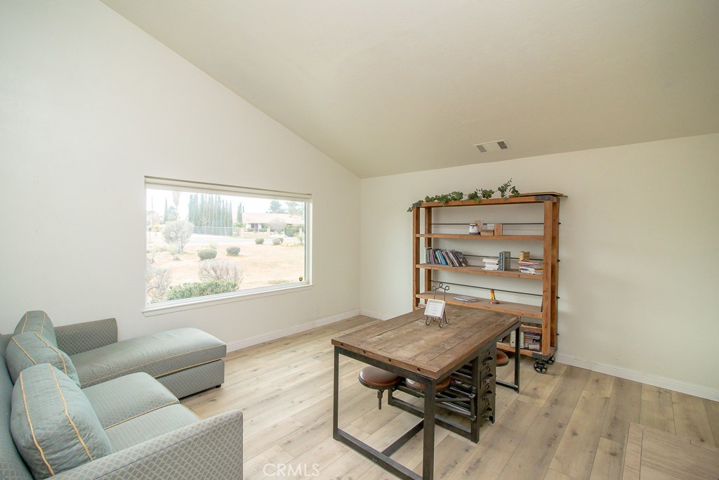 20376 Tonawanda Road Apple Valley, CA 92307 - Photo 9 of 67 a living room with furniture and a window