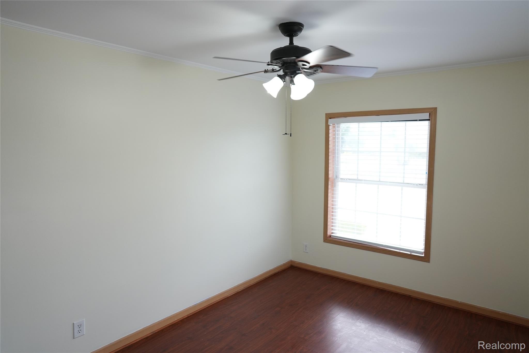 2018 John R Road Troy, MI 48083 - Photo 43 of 57 Wood-finish flooring, single window with blinds, ceiling fan with integrated lighting, and crown molding