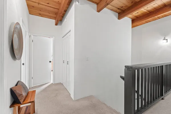 a bedroom with a large bed and a flat tv