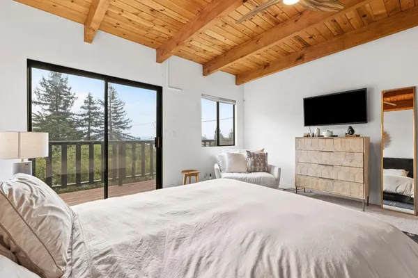 a view of a balcony with wooden fence and floor