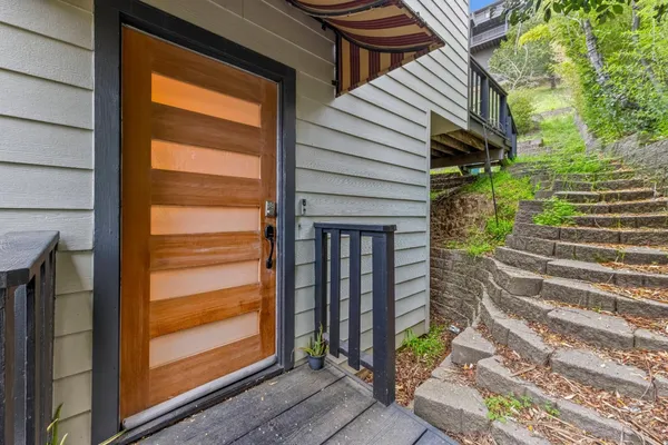 a view of front door with wooden floor