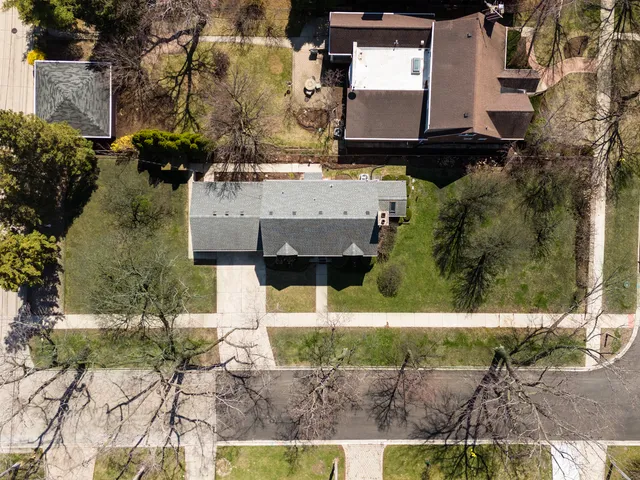 an aerial view of residential house with outdoor space and parking