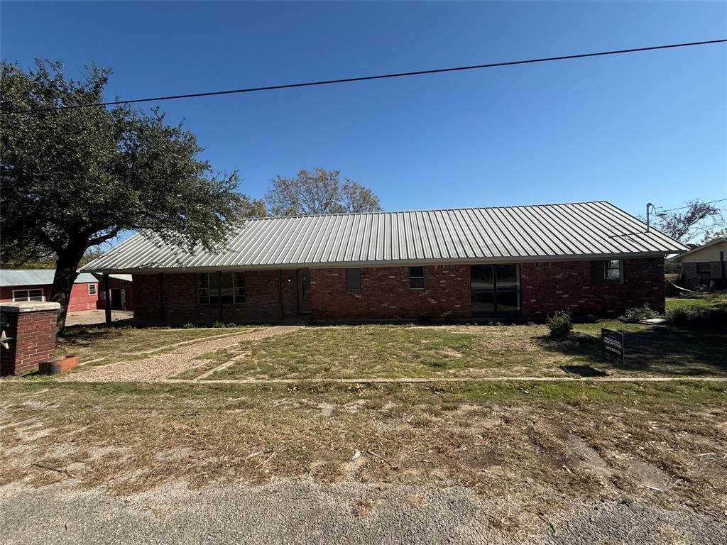 1102 Chilton Street Weatherford, TX 76086 - Photo 1 of 28 a front view of a house with a yard