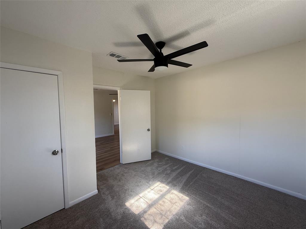1102 Chilton Street Weatherford, TX 76086 - Photo 13 of 28 a view of a livingroom with a ceiling fan and window