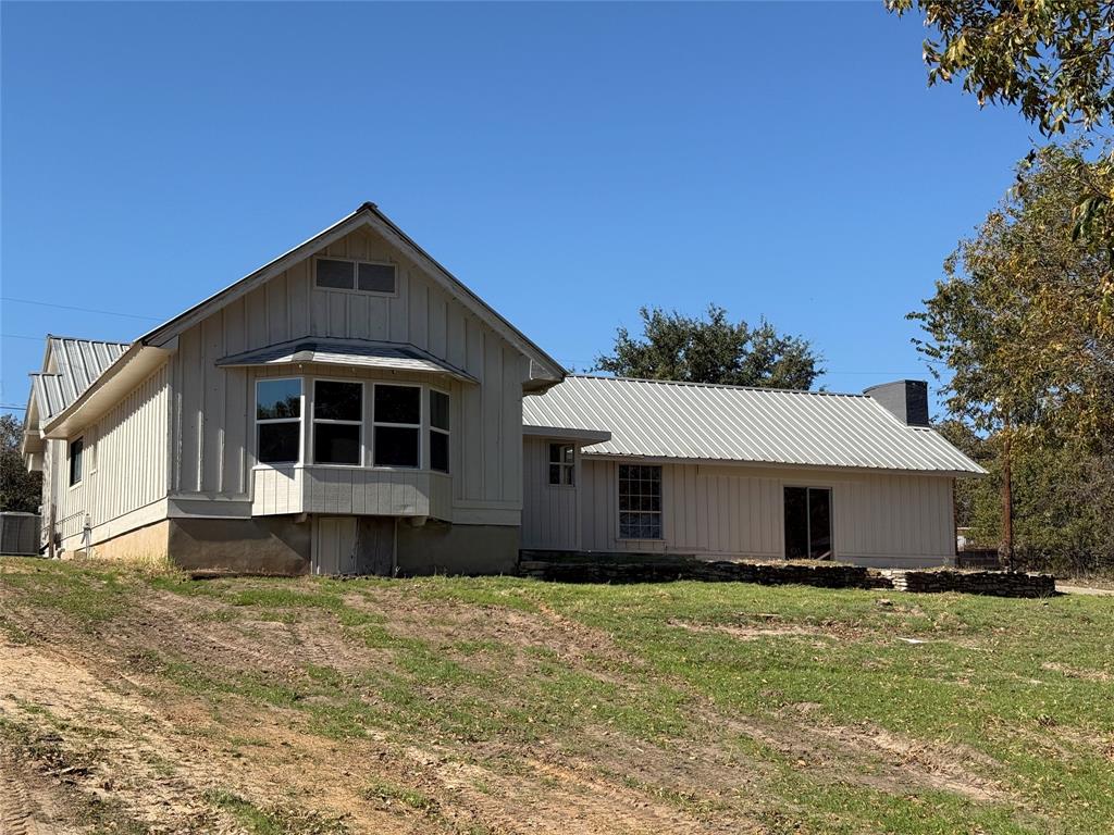 1102 Chilton Street Weatherford, TX 76086 - Photo 25 of 28 a front view of a house with a yard