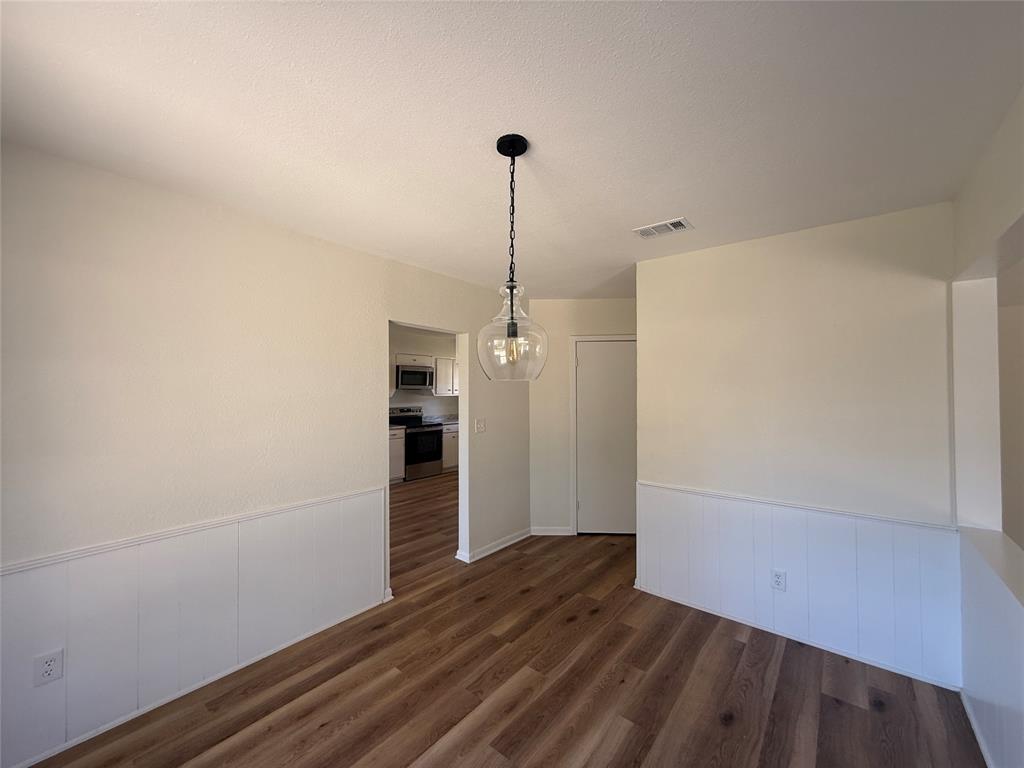 1102 Chilton Street Weatherford, TX 76086 - Photo 5 of 28 a view of empty room with wooden floor