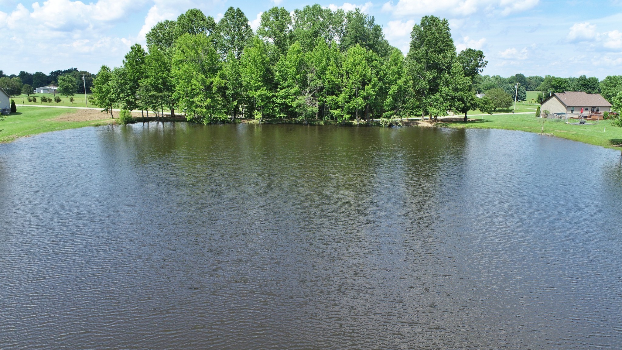 4 Gil Hodges Road Portland, TN 37148 - Photo 12 of 16 a view of a lake with houses in the back
