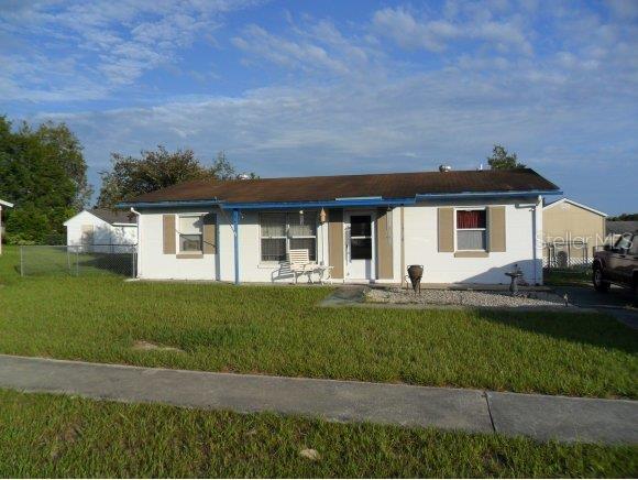 3786 Southwest 147 Lane Road Ocala, FL 34473 - Photo 1 of 1 a front view of a house with a yard