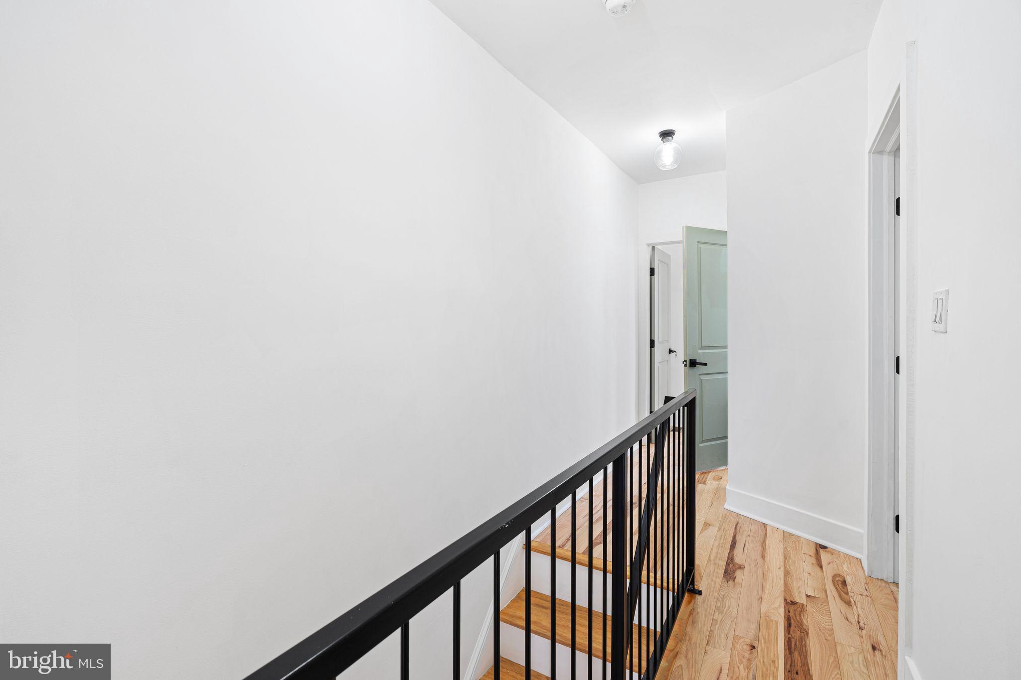 2937 Nicholas Street Philadelphia, PA 19121 - Photo 22 of 33 a view of a hallway with a hallway