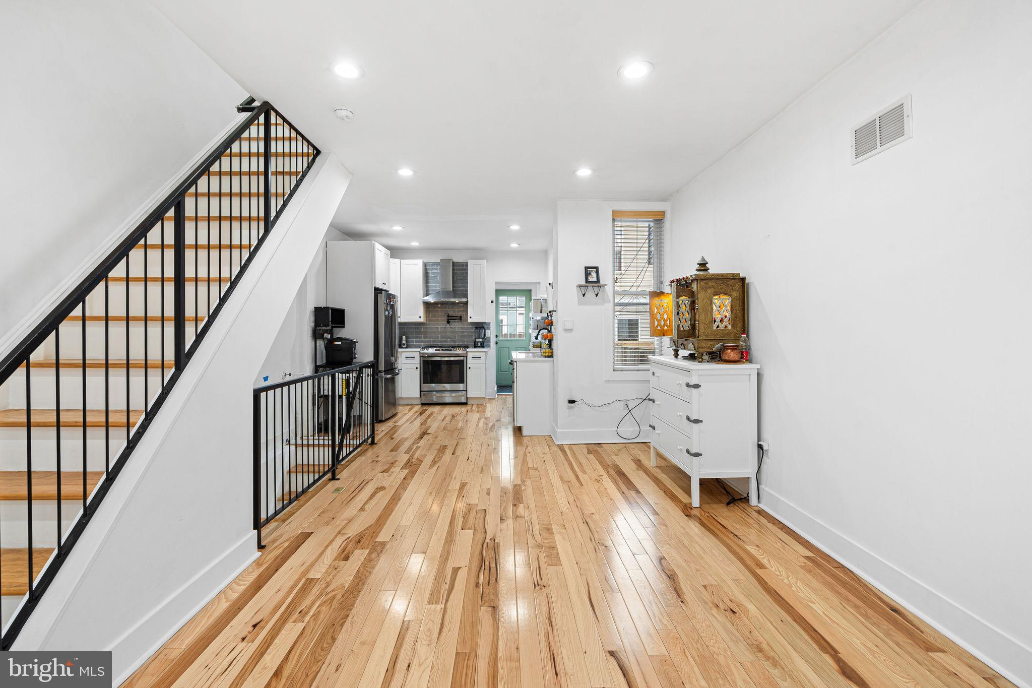 2937 Nicholas Street Philadelphia, PA 19121 - Photo 7 of 33 a view of a kitchen with wooden floor and electronic appliances