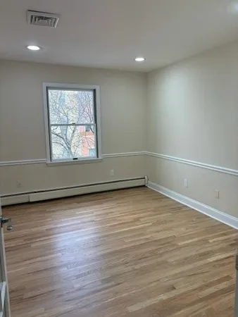 a view of an empty room with a large window