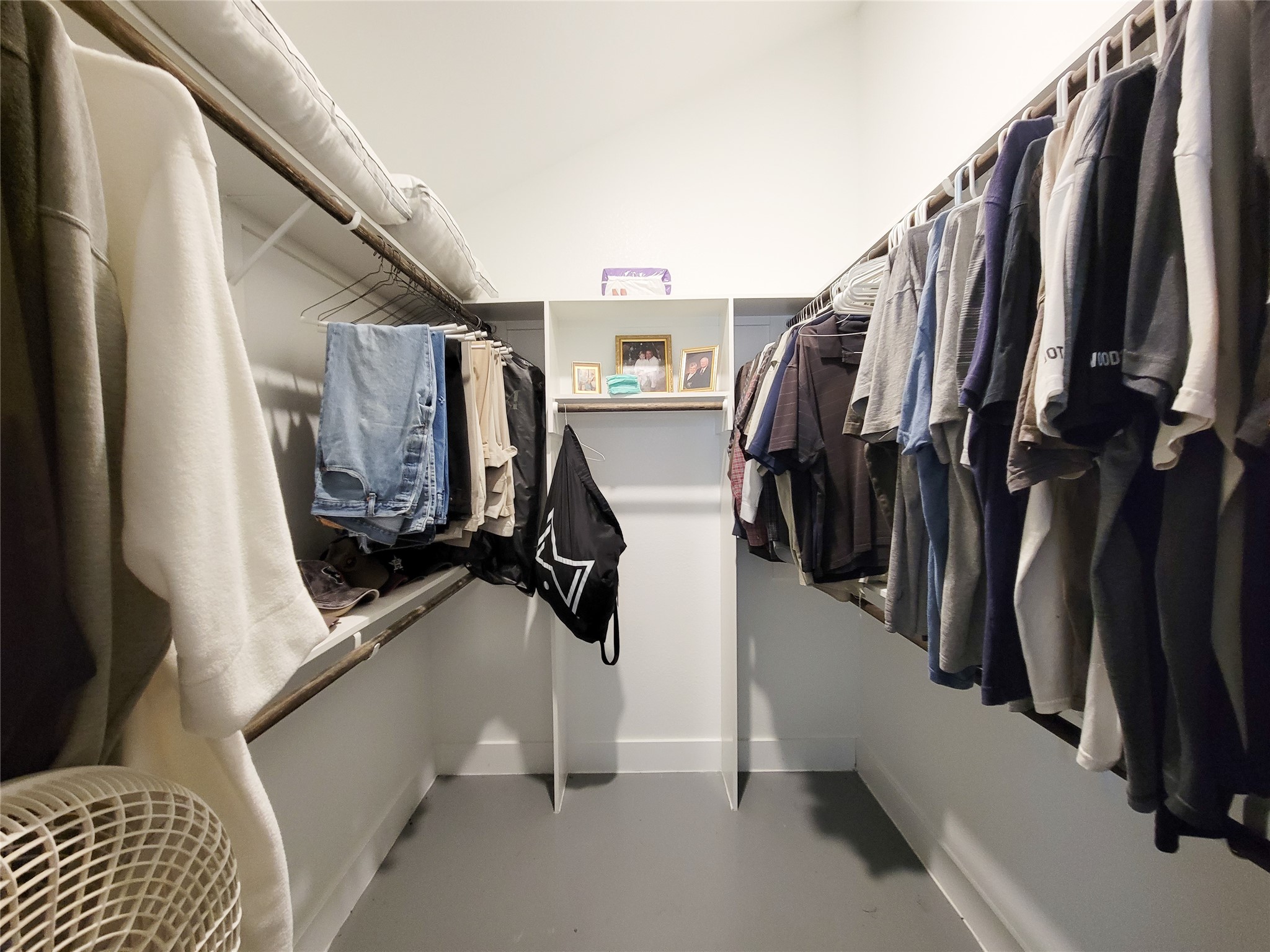 4937 Wolff Road Round Top, TX 78954 - Photo 16 of 31 Spacious primary closet with custom built-in shelving.