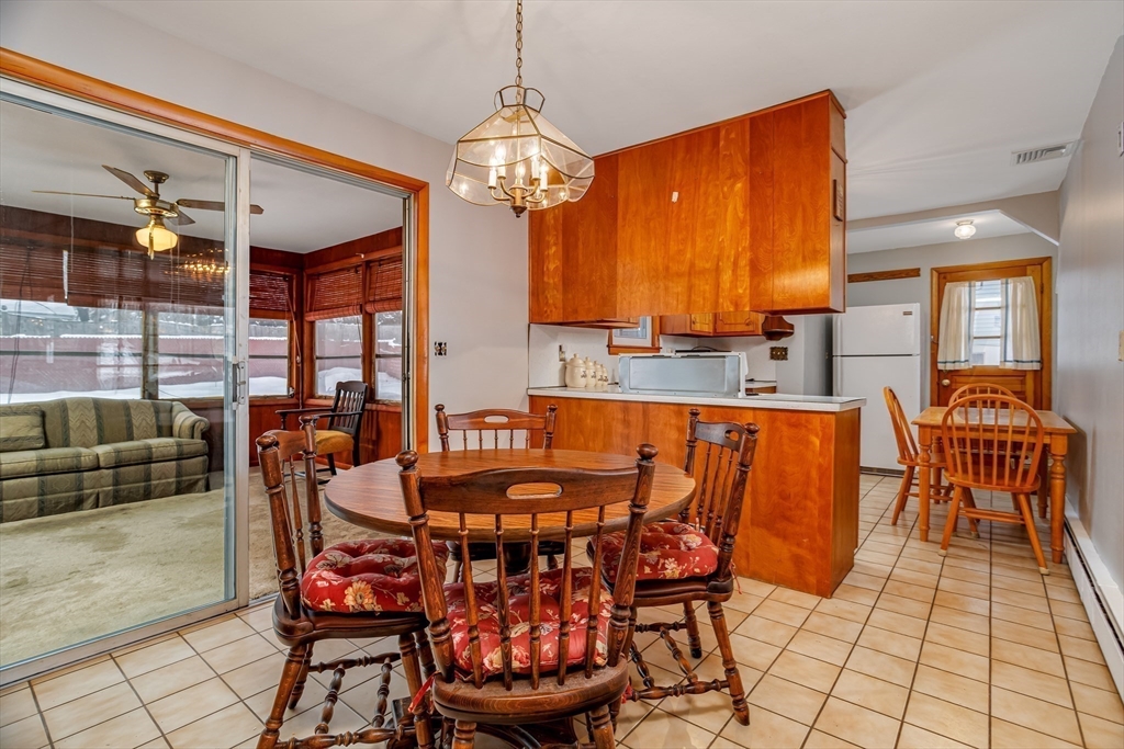 34 Robin Road Worcester, MA 01604 - Photo 13 of 42 a dining room with furniture a chandelier and window