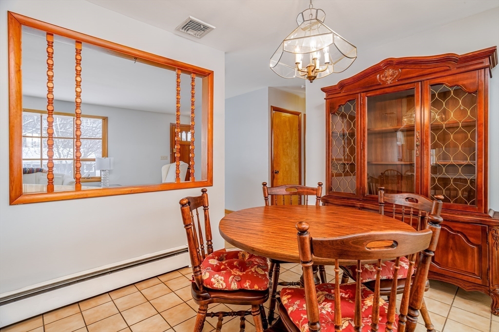 34 Robin Road Worcester, MA 01604 - Photo 18 of 42 a dining room with furniture a chandelier and window