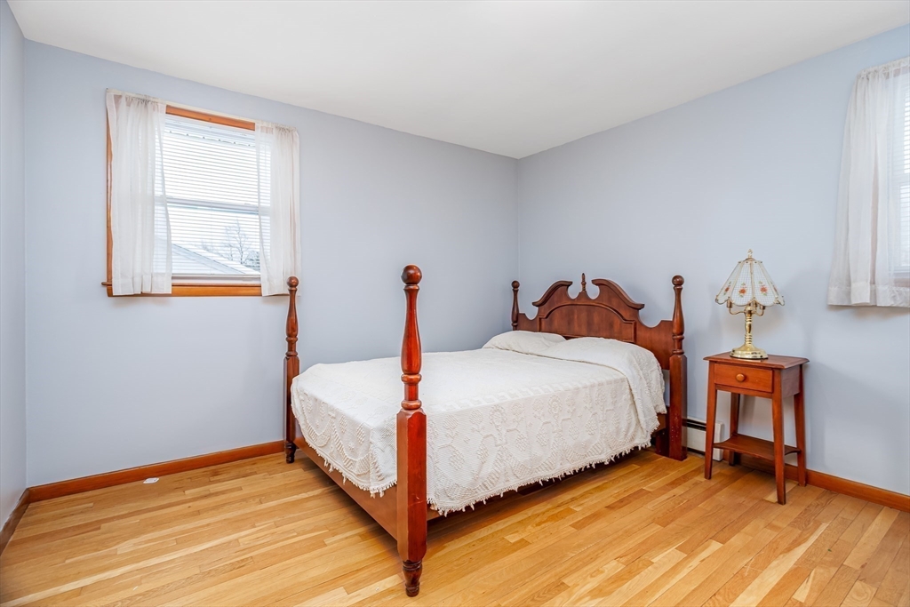 34 Robin Road Worcester, MA 01604 - Photo 19 of 42 a bed sitting in a bedroom next to a window