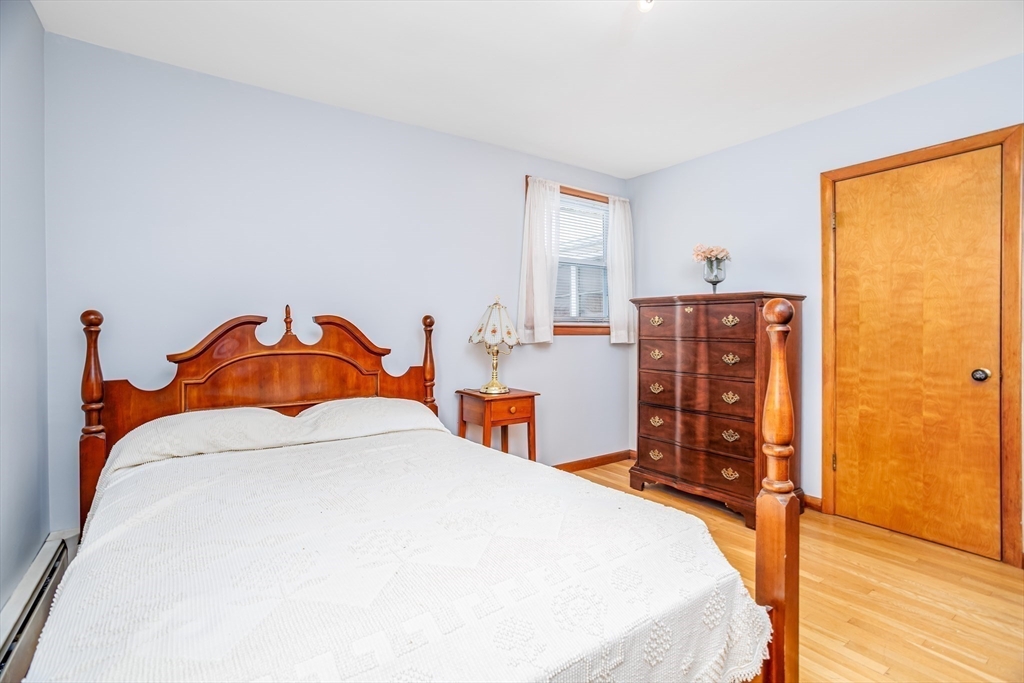 34 Robin Road Worcester, MA 01604 - Photo 20 of 42 a bedroom with a bed and a dresser