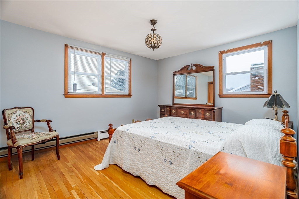 34 Robin Road Worcester, MA 01604 - Photo 22 of 42 a bedroom with a bed and wooden floor