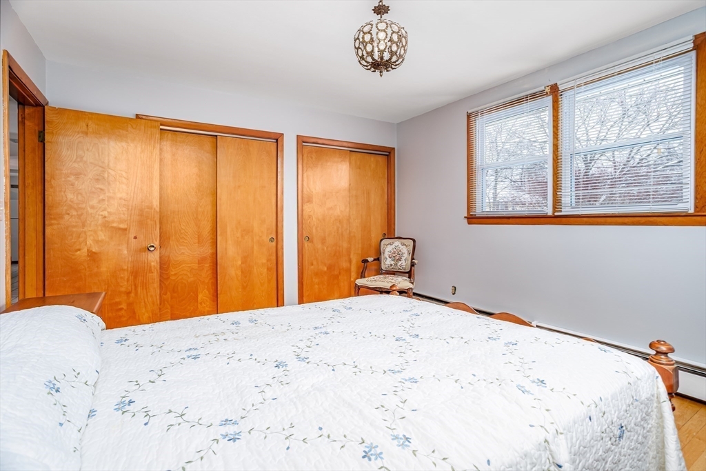 34 Robin Road Worcester, MA 01604 - Photo 23 of 42 a bedroom with a bed and a window
