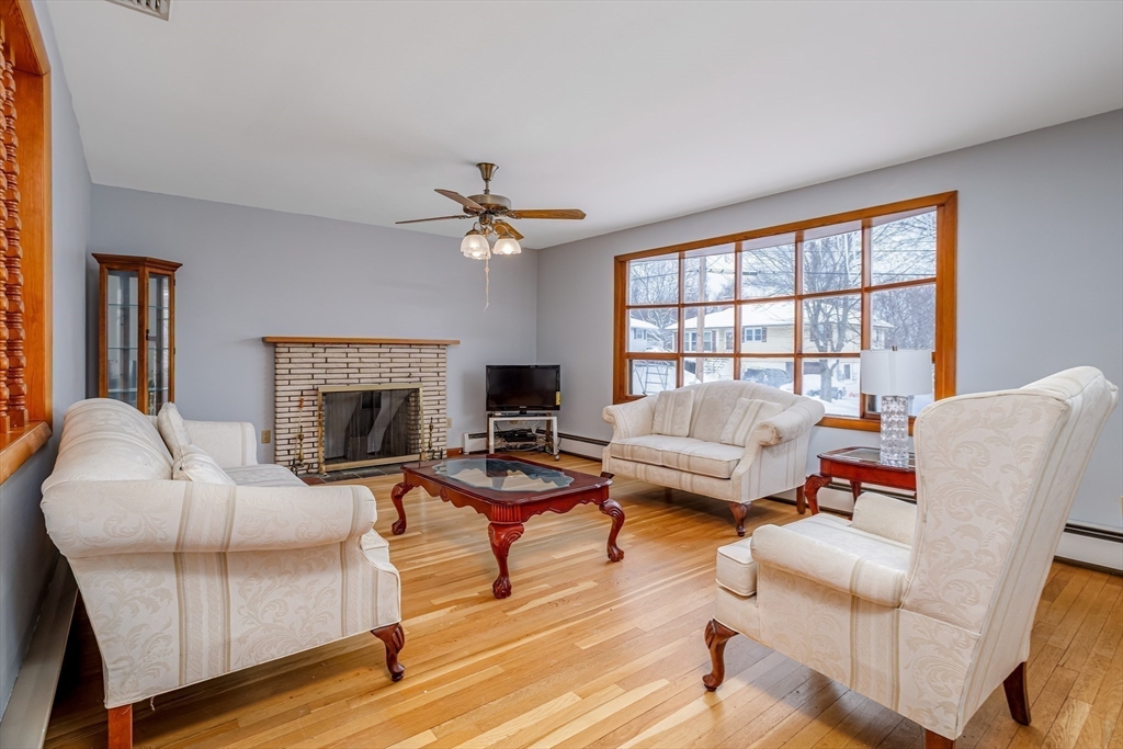 34 Robin Road Worcester, MA 01604 - Photo 9 of 42 a living room with furniture a fireplace and a table