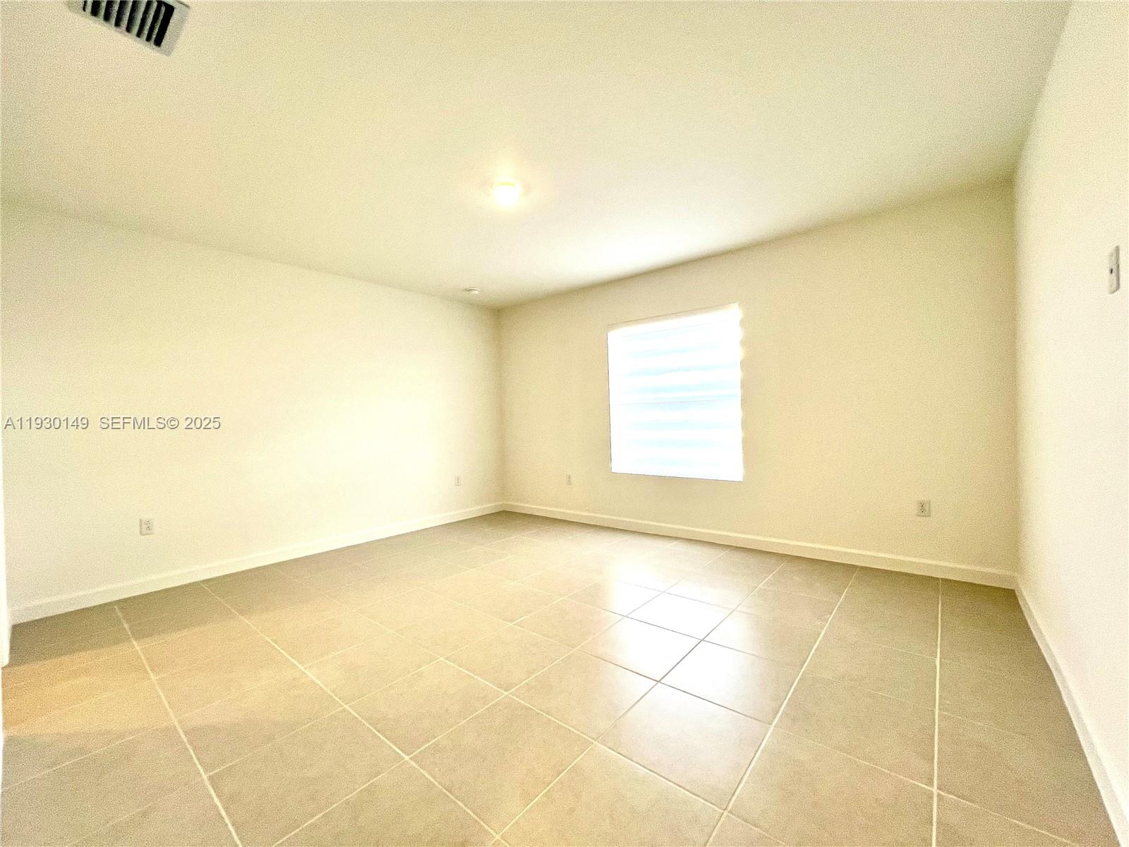 17376 Southwest 285th Street, Unit 1 Homestead, FL 33030 - Photo 14 of 32 a view of an empty room
