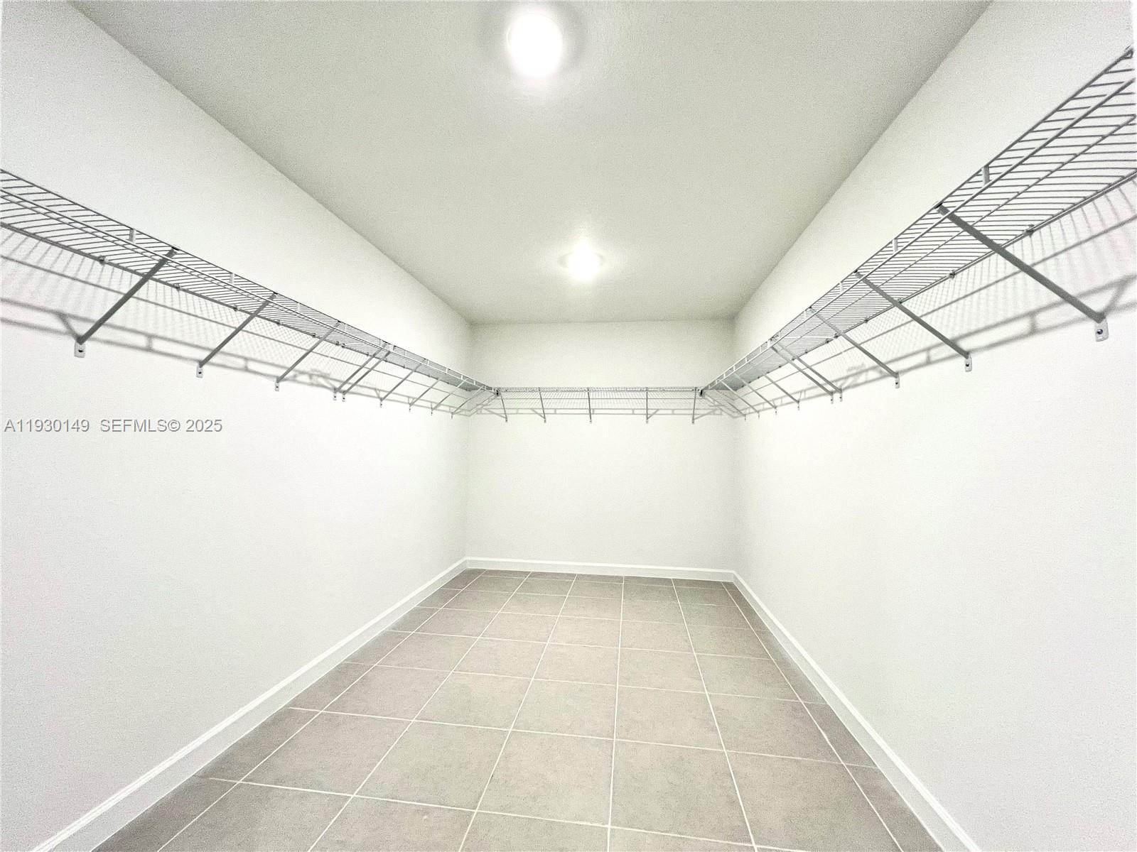 17376 Southwest 285th Street, Unit 1 Homestead, FL 33030 - Photo 15 of 32 a view of a room with window and tiles