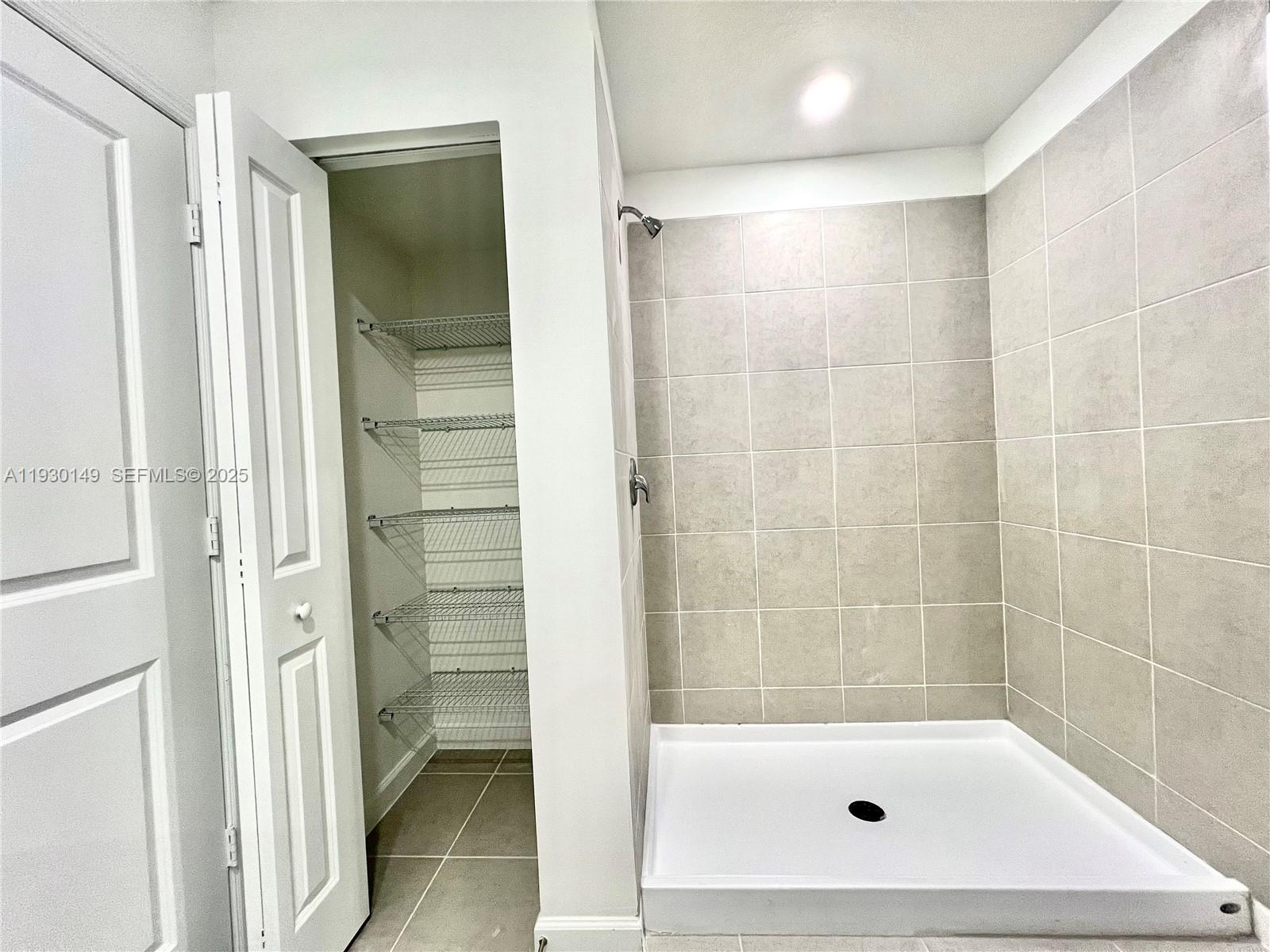 17376 Southwest 285th Street, Unit 1 Homestead, FL 33030 - Photo 18 of 32 a bathroom with a tub and shower