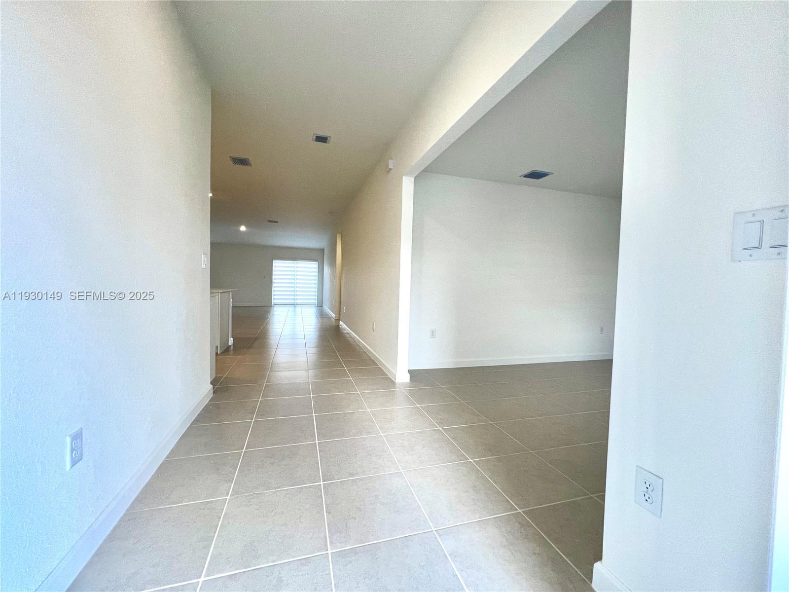 17376 Southwest 285th Street, Unit 1 Homestead, FL 33030 - Photo 3 of 32 a view of a hallway