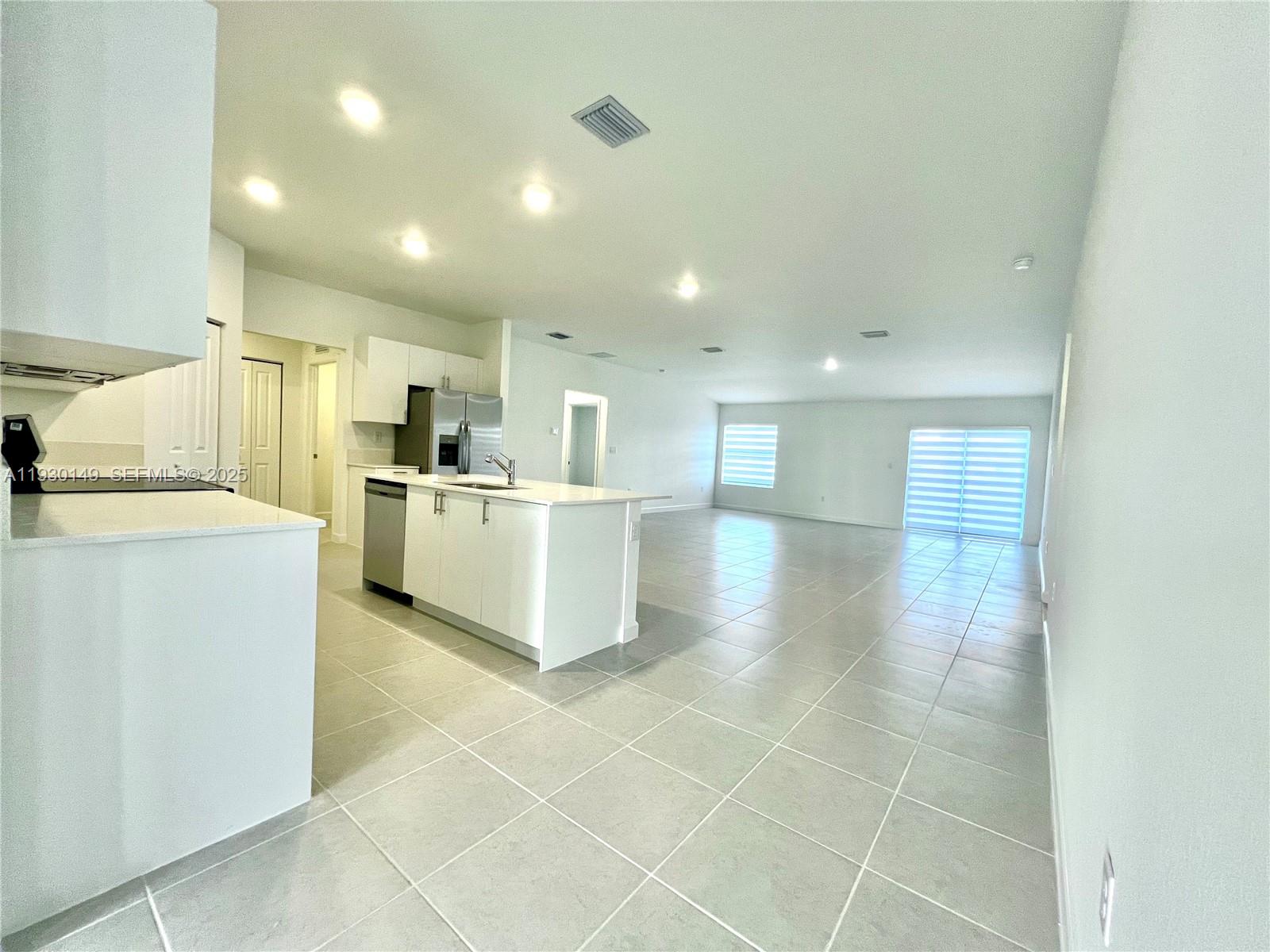17376 Southwest 285th Street, Unit 1 Homestead, FL 33030 - Photo 5 of 32 a view of a kitchen with a sink