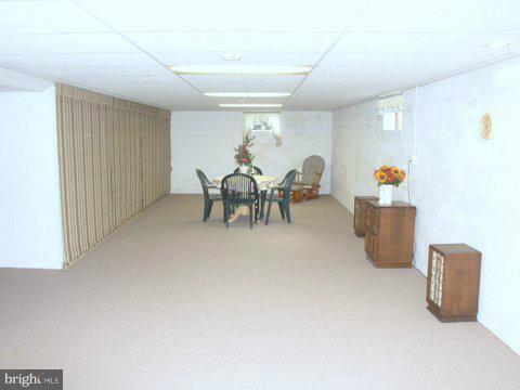 5218 Forge Road Perry Hall, MD 21128 - Photo 12 of 22 a living room with furniture and a table