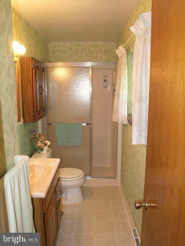 5218 Forge Road Perry Hall, MD 21128 - Photo 15 of 22 a bathroom with a sink toilet and shower